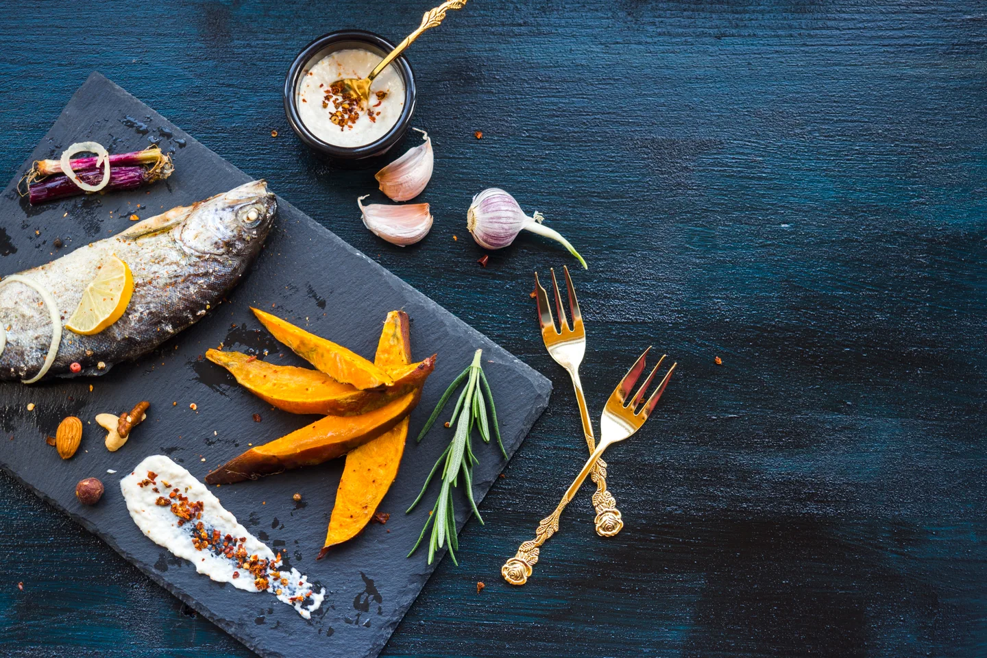 Fish, vegetables and tableware in the Klapkalnciema Zivis website imagery