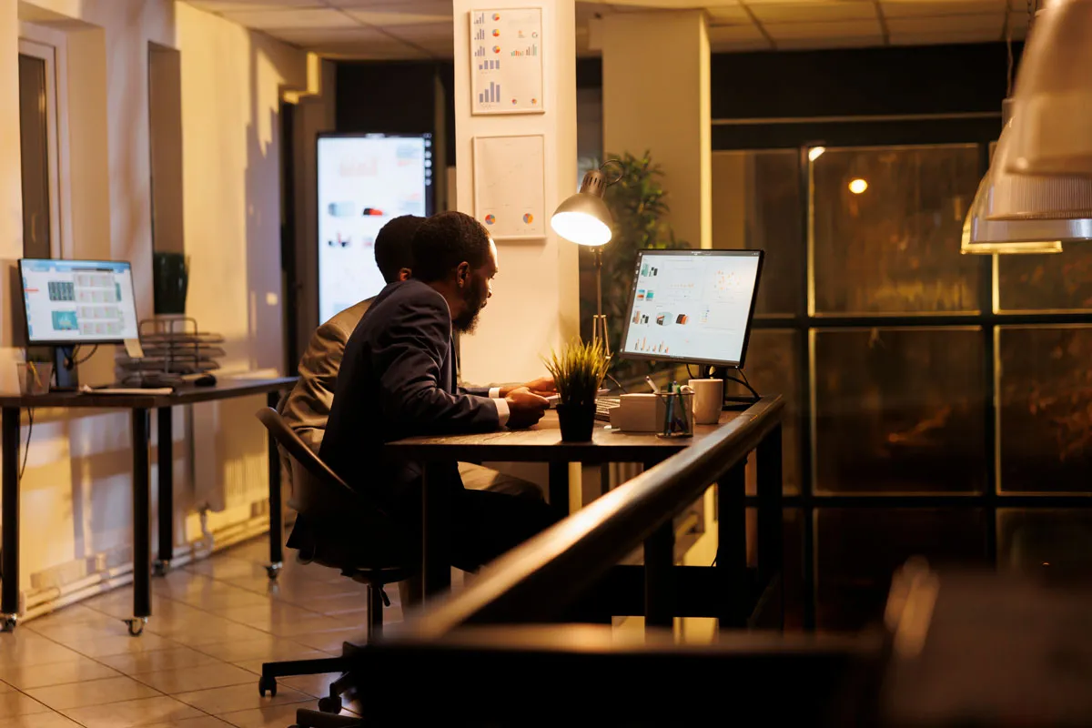 Illustration of a guest using a laptop in a hotel lounge