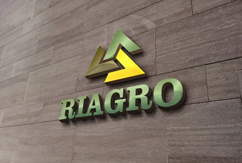 Riagro lettering and a geometric green emblem mounted on a wall