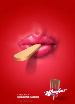 Red ice-cream advertisement with lips and a wooden stick