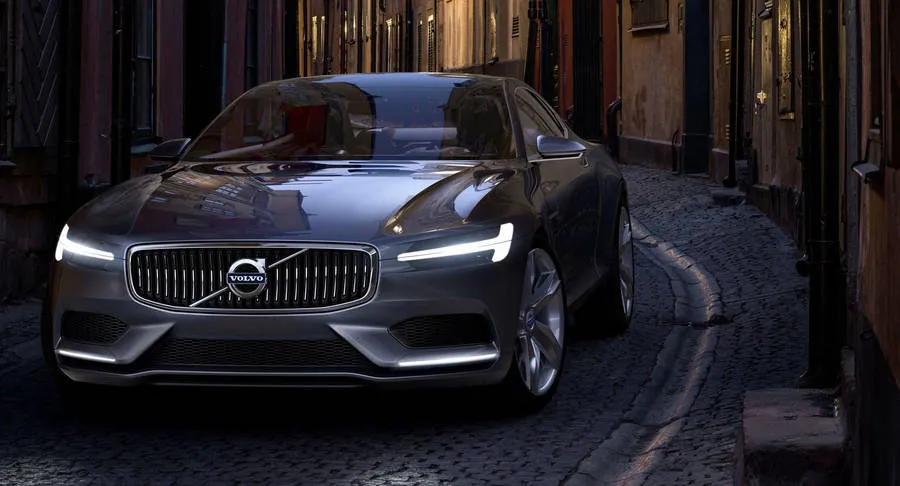 A silver Volvo on a city street