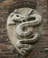 Carved Visconti serpent emblem on stone