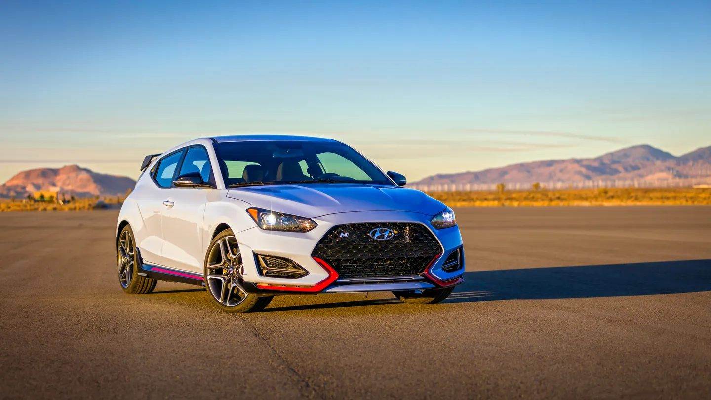 A white Hyundai Veloster on a track